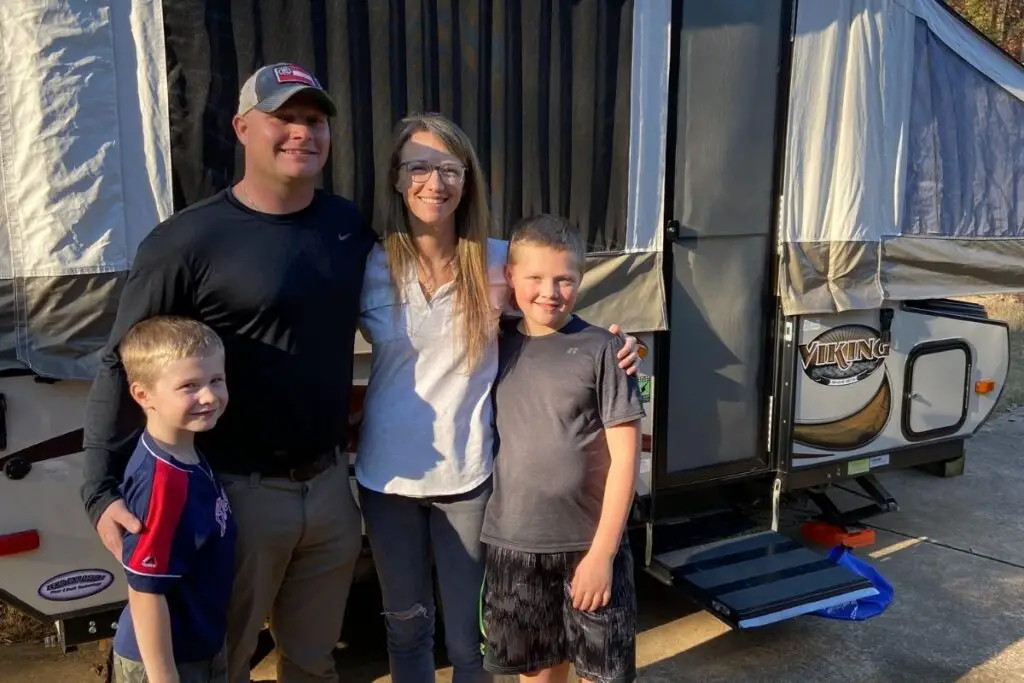 my family in front of our popup camper