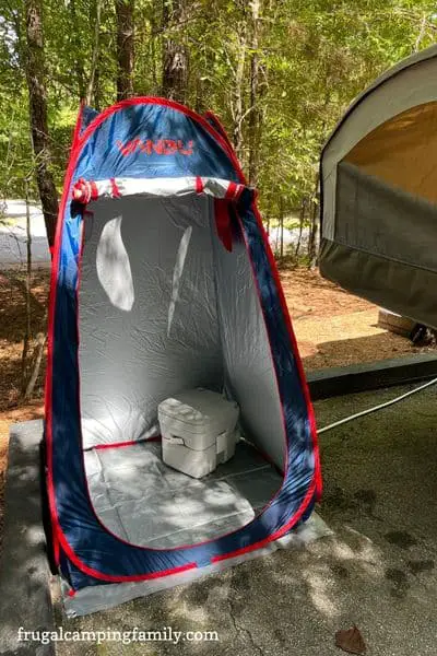 camp shower with camp toilet inside